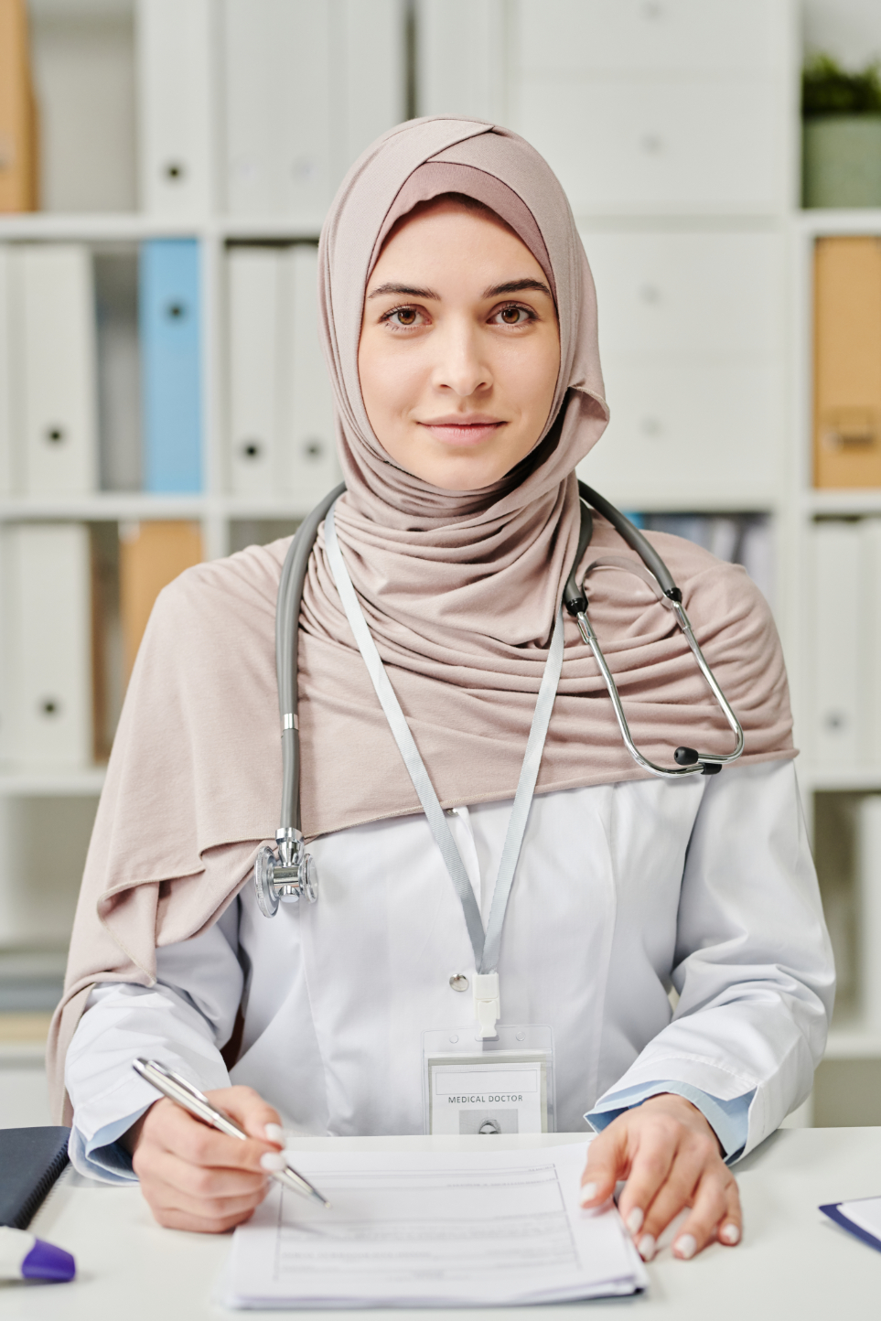 happy young female in hijab and whitecoat making n FN4FFBD 1
